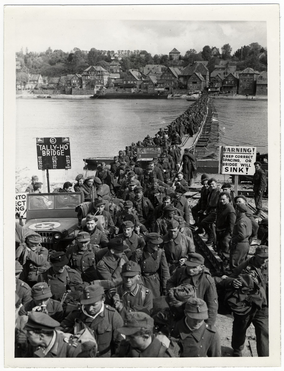 German soldiers cross the Elbe River as they surrender to British forces.