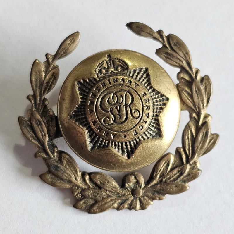 Army Veterinary Corp button mounted on to a wreath design badge.